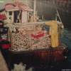 MFV Francis-Kate loaded with herring coming down pier (early 90's)